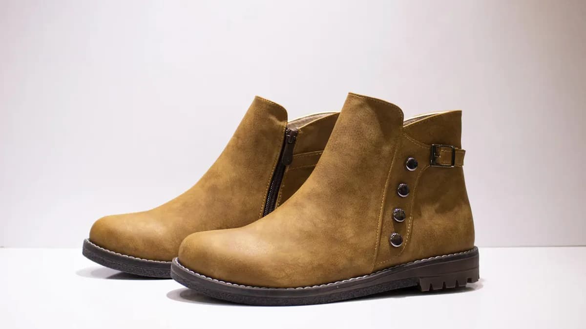 Leather boot product photo staged as a Shopify Performance Max image asset for Google Ads