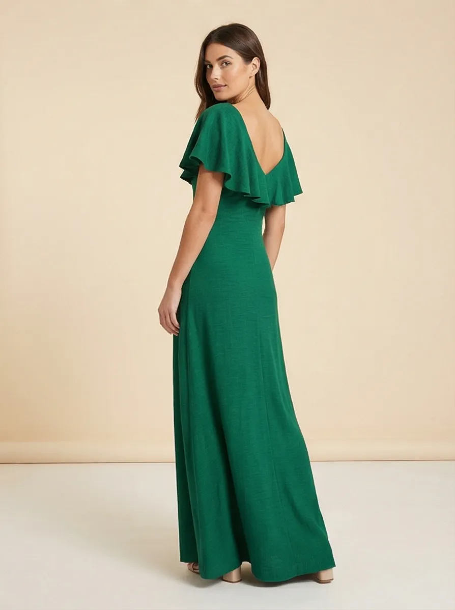 AI-generated lifestyle photo of a green dress modeled in an elegant setting
